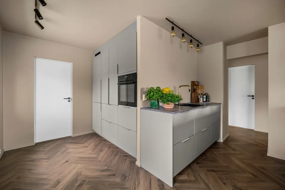 New kitchen with light fronts and integrated appliances